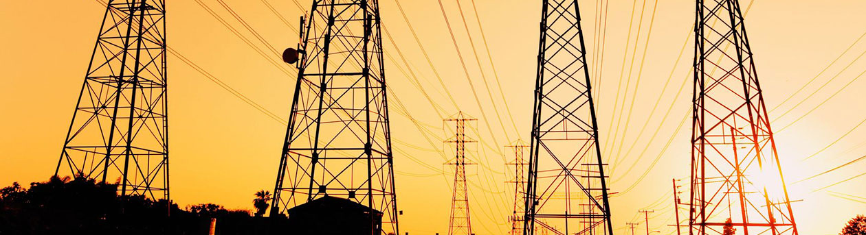 electricity pylons in the morning sun